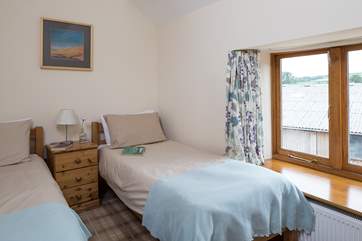 The other twin room also with views over the farm buildings and the fields beyond.