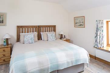 The master bedroom - with 'zip and link' beds - set up here as a super-king size bed, but it can be made up as twin beds if you prefer.
