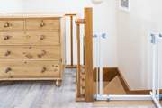 A stair-gate keeps your little ones safe.