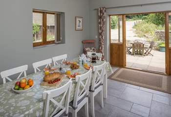 The kitchen/dining-room has French doors to the patio where you can watch the daily comings and goings of farm life.