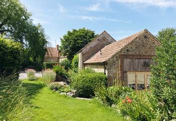 Up a few steps from the patio is a private lawned area for your use. (Please note it is not enclosed).