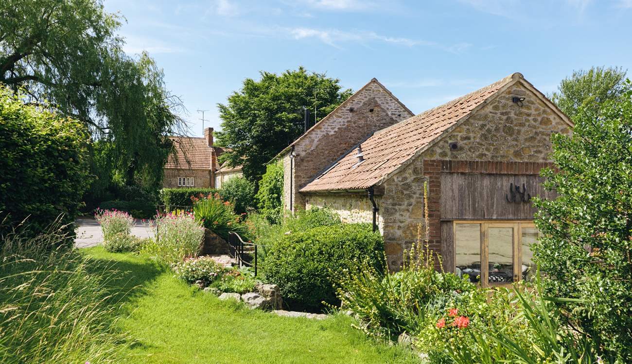 Up a few steps from the patio is a private lawned area for your use. (Please note it is not enclosed).