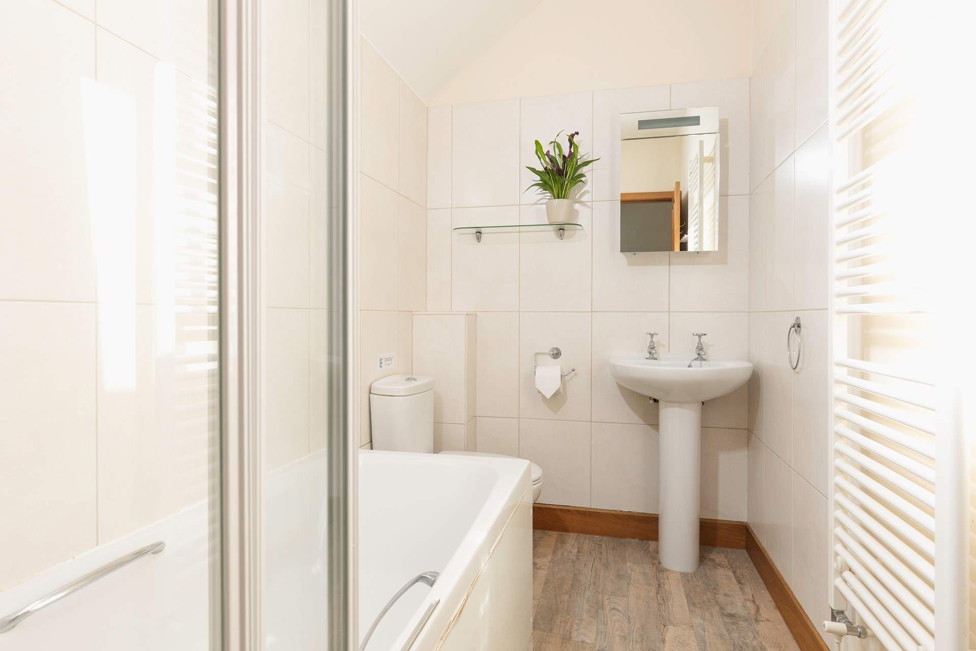 Upstairs you will find the family bathroom.