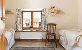 Peeking in to the first twin bedroom. There will often be livestock in the barns pictured through the window. - Thumbnail Image