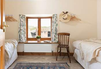 Peeking in to the first twin bedroom. There will often be livestock in the barns pictured through the window.
