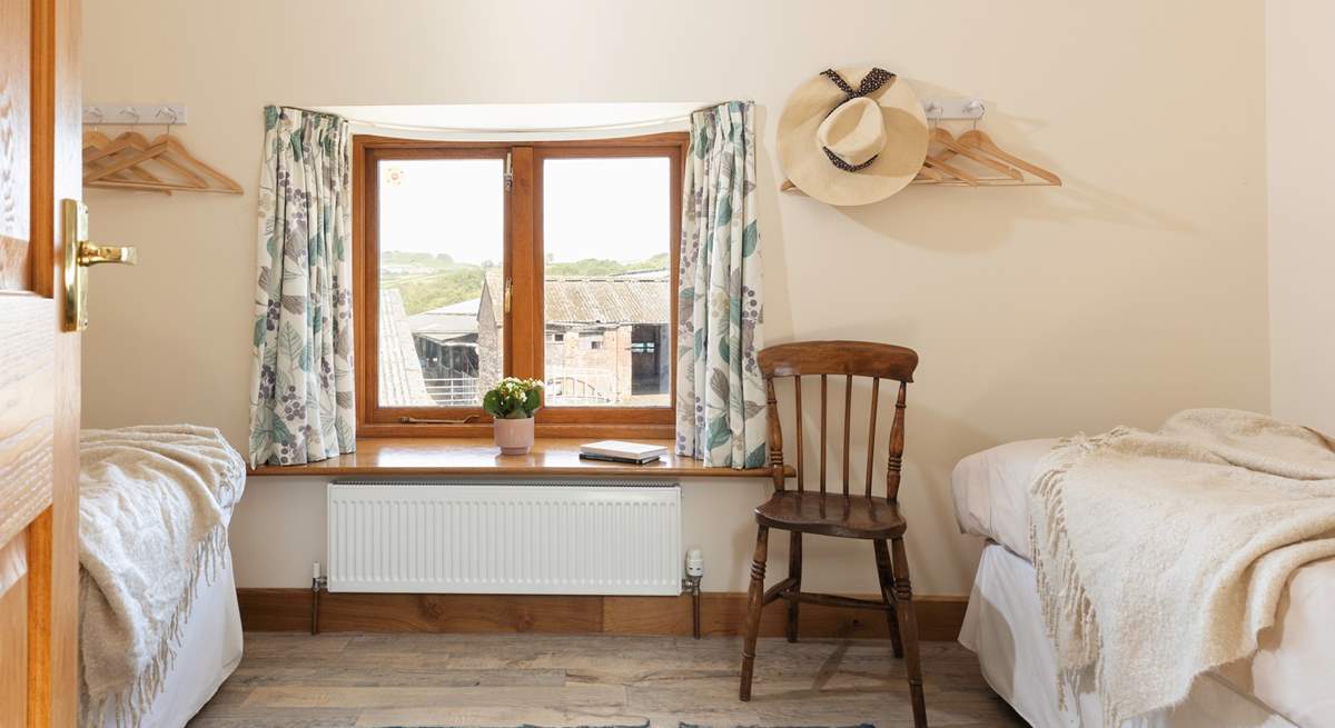 Peeking in to the first twin bedroom. There will often be livestock in the barns pictured through the window.