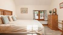 Relax in the main bedroom with sumptuous super-king bed, that can also be split in to two full size singles.