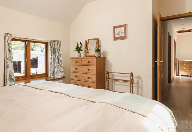 Calming tones in the main bedroom will help you to switch off.