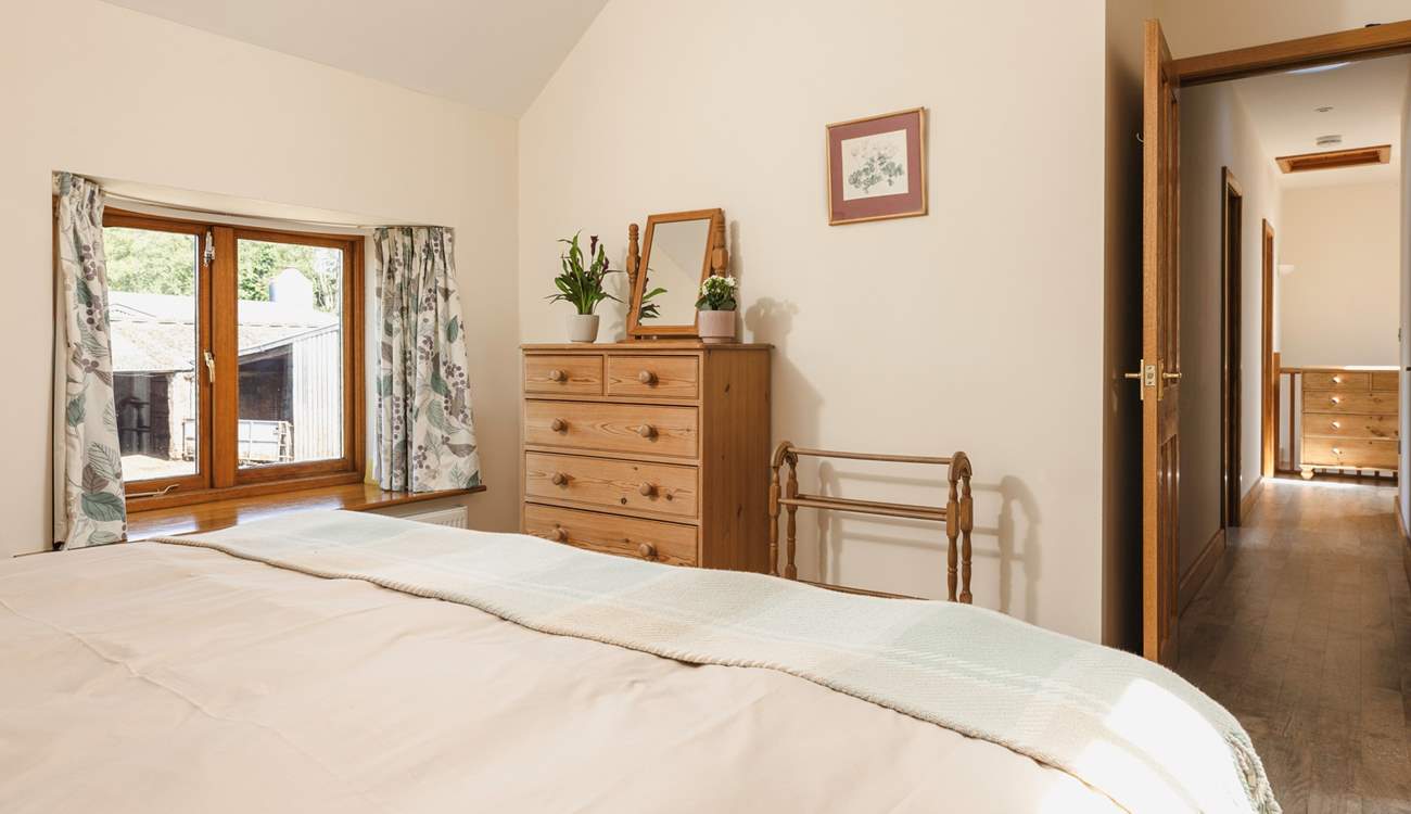 Calming tones in the main bedroom will help you to switch off.