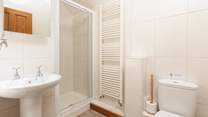 The en suite shower-room is modern and bright.