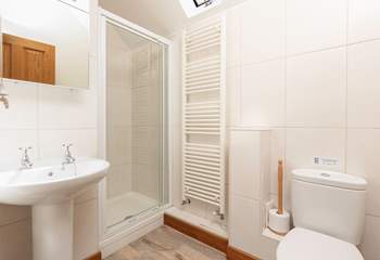 The en-suite shower room is modern and bright.