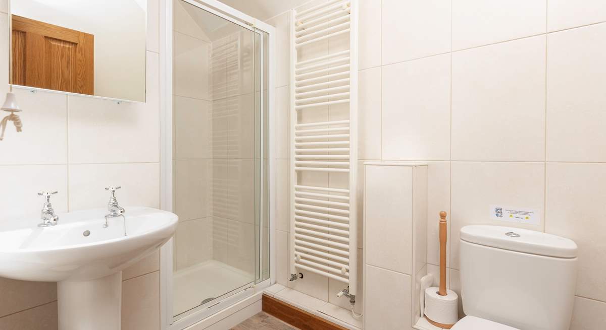 The en-suite shower room is modern and bright.