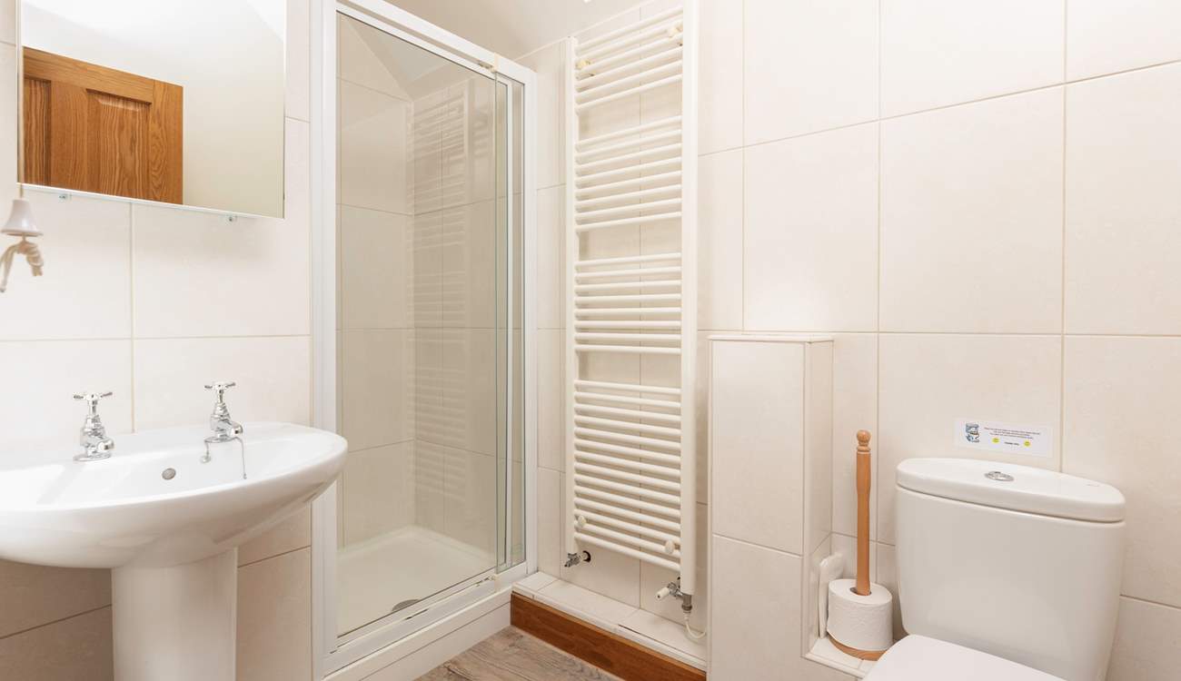 The en-suite shower room is modern and bright.