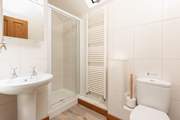 The en-suite shower room is modern and bright.
