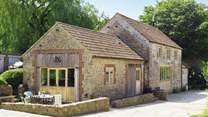 The unique farm setting will make for a memorable holiday. The livestock barns are opposite the cottage.