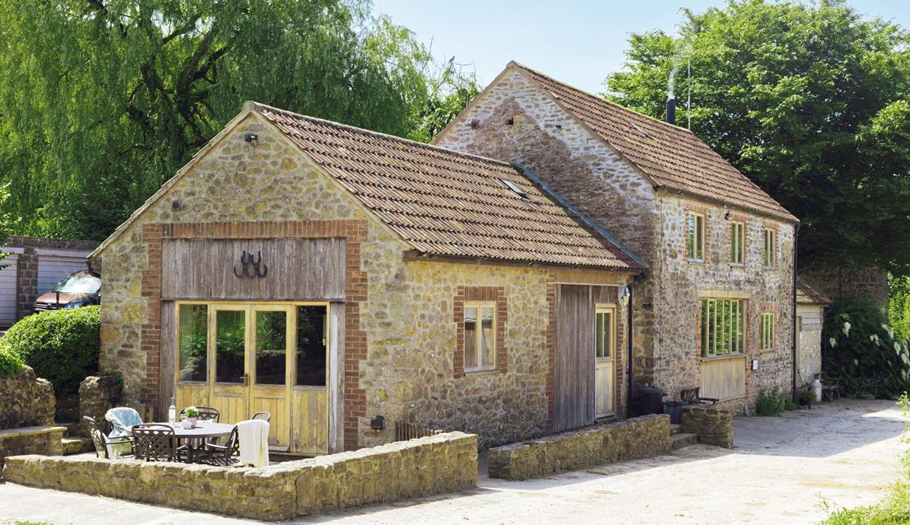 The unique farm setting will make for a memorable holiday. The livestock barns are opposite the cottage.