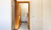 Straight ahead in this photo is the downstairs utility room and WC and to the left is the shower. - Thumbnail Image