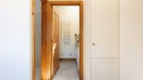 Straight ahead in this photo is the downstairs utility-room and WC and to the left is the shower.