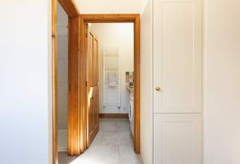 Straight ahead in this photo is the downstairs utility-room and WC and to the left is the shower.