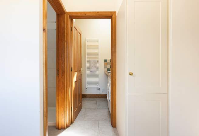 Straight ahead in this photo is the downstairs utility-room and WC and to the left is the shower.