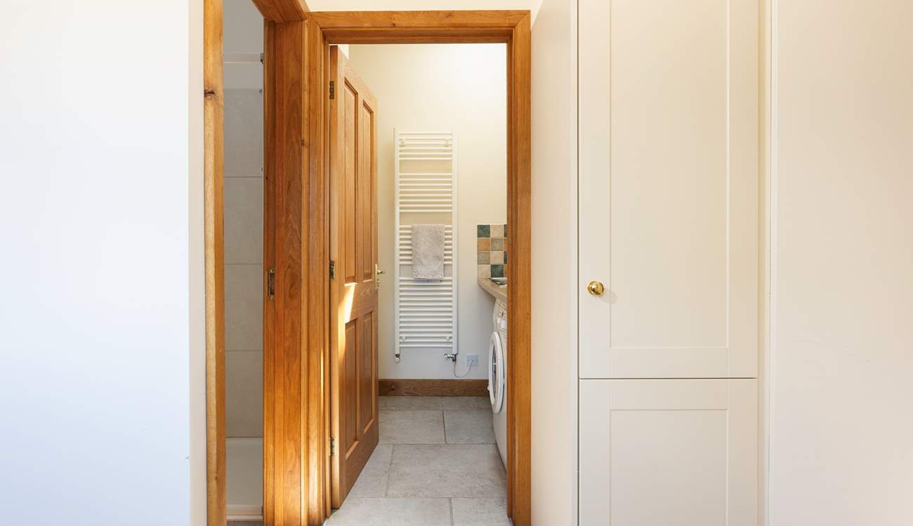 Straight ahead in this photo is the downstairs utility-room and WC and to the left is the shower.