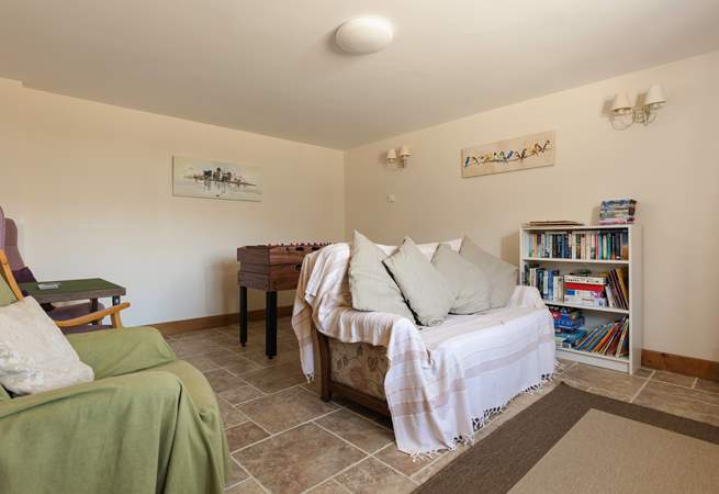 The playroom has lots of toys and books to keep children entertained.