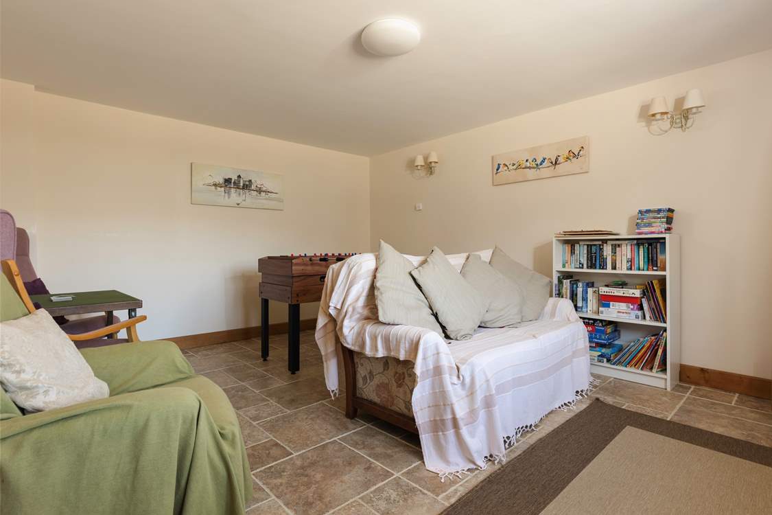 The playroom has lots of toys and books to keep children entertained.