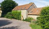 The rear of Sturthill Stable where you will park up and walk across the bridge that runs over a little stream, idyllic!  - Thumbnail Image