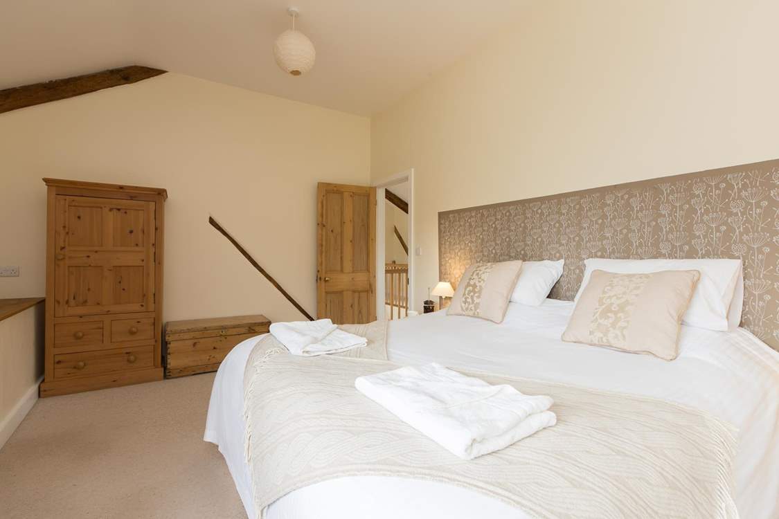 This bedroom (Bedroom 3) looks out over the garden.