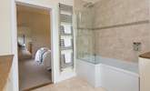 This bedroom has a bath with a fitted shower. - Thumbnail Image