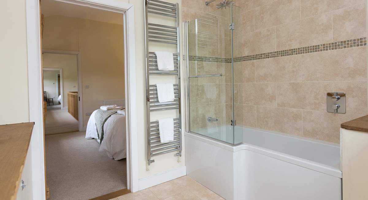 This bedroom has a bath with a fitted shower.