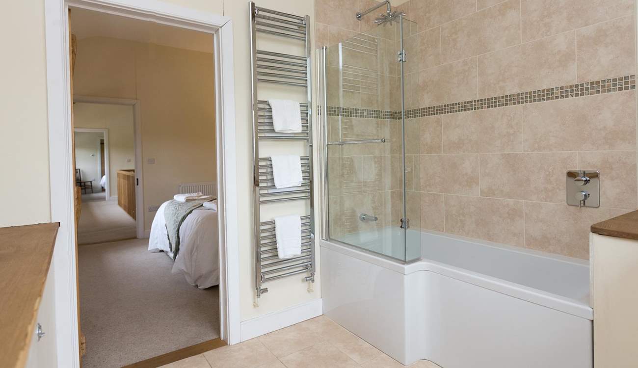 This bedroom has a bath with a fitted shower.