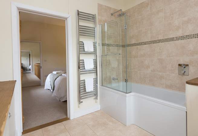 This bedroom has a bath with a fitted shower.
