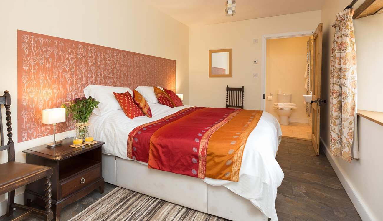 This is the ground floor bedroom (Bedroom 1), with its rich and welcoming colour theme.