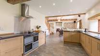 There is a superbly equipped kitchen, including a full-size fridge. The space is open plan to the rest of the living-area so very sociable.