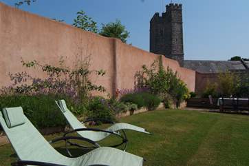 Looking down the length of the garden - with the pretty village church in the background.