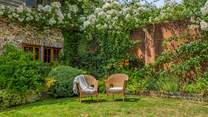 Sit back and relax in this fabulous sunny garden.