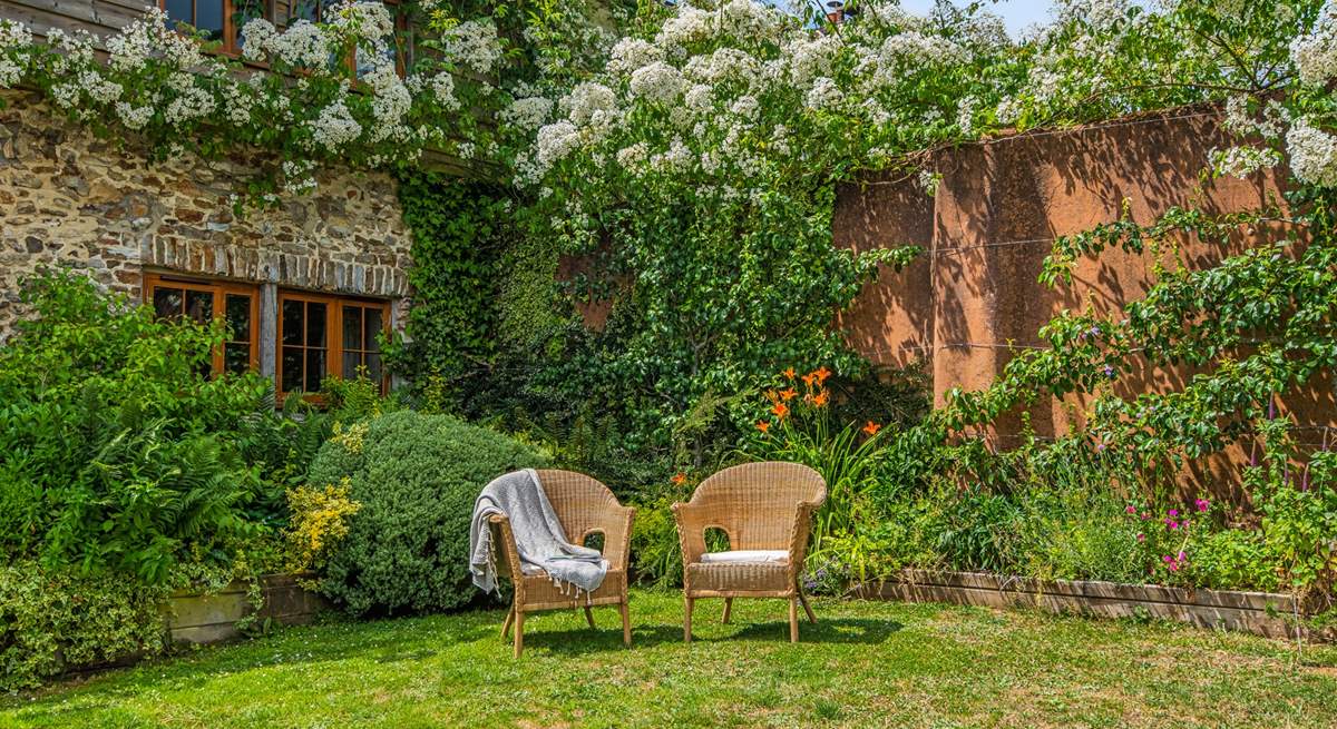 Sit back and relax in this fabulous sunny garden.