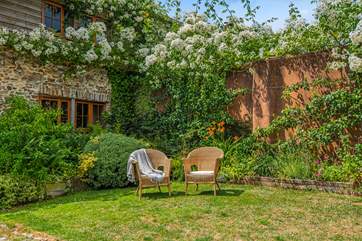 Sit back and relax in this fabulous sunny garden.
