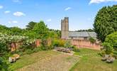 A view of the garden - with the pretty village church in the background. - Thumbnail Image