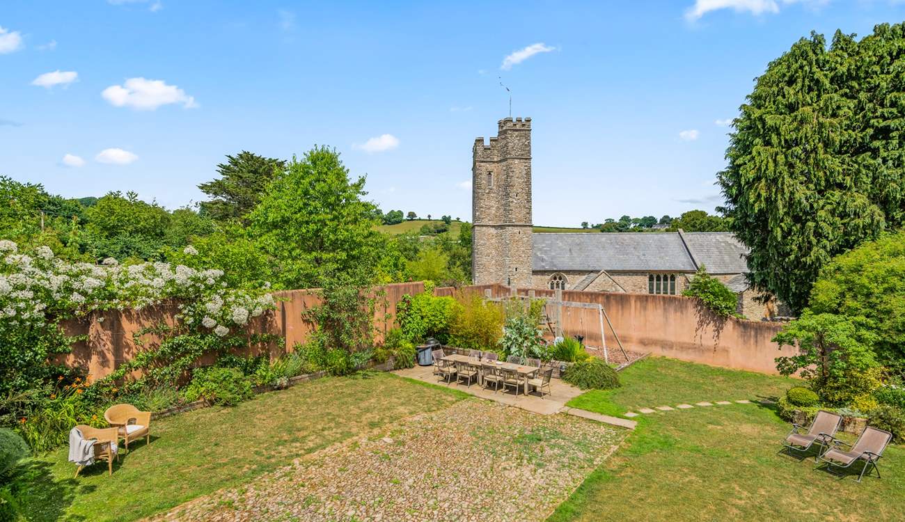 A view of the garden - with the pretty village church in the background.