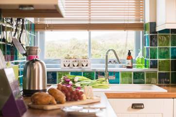 The kitchen window looks out over fields towards the cliffs.
