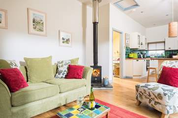 Comfy sofa and chairs in lovely fabrics with bright pops of colour.