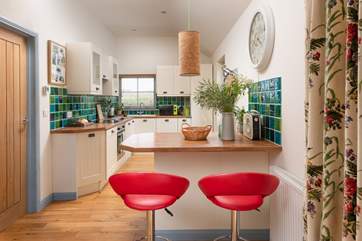 Sit on a stool and chat with the chef.