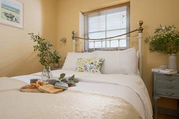 The stylish vintage furniture looks lovely in the bedroom.