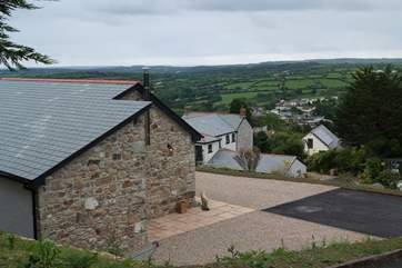 Bolivar Barn sits on the hill overlooking the owners' home below and the countryside beyond.
