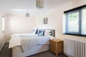 The lovely linens and cushions on the 6' double bed which can also be made up as two 3' twin beds on request.