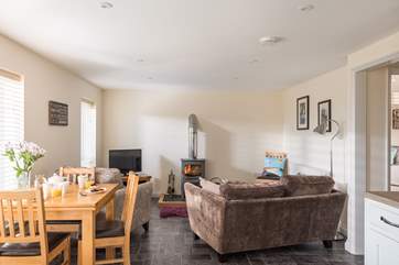 The open plan living-room is light, spacious and stylishly furnished.
