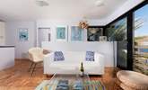 Interior touches of turquoise and lime blend seamlessly with the palm tree fronds and ocean views. - Thumbnail Image