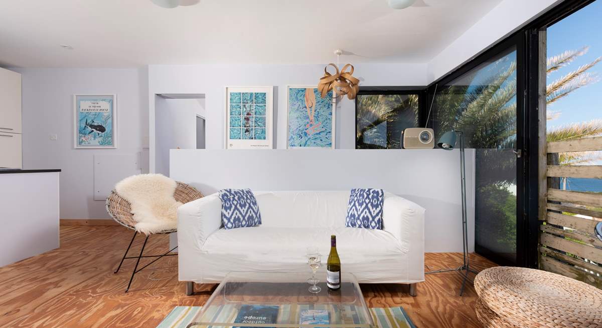 Interior touches of turquoise and lime blend seamlessly with the palm tree fronds and ocean views.